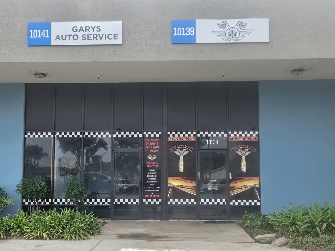 Gary's Auto Service storefront at 10139 Prospect Ave with checkered window graphics